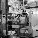 Production machine at NCP for making chairs.
