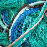 Close picture of fishing nets in colorful colors.