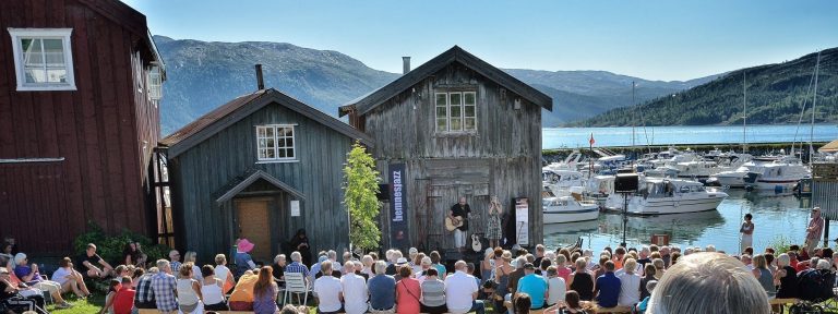 Popular concert at Lapphella at Hemnesberget during jazz festival right next to the fjord on a warm sunny summer day.