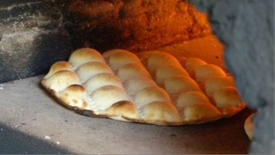 Close-up of the local bread, “kamkake” in the baking oven.