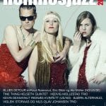Front cover of Hemnesjazz’s festival paper showing three colorful divas/hippies in glittery outfits ready to play music.