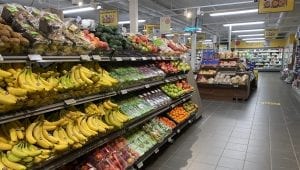 A colorful and full fruit section at one of the local stores, Coop Korgen, with an overview of other sections further in. 