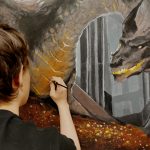 Boy painting a dragon